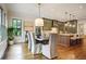 Dining area with pendant lights, hardwood floors, and view of the kitchen at 11 Brownson Ct, Acworth, GA 30101