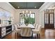 Elegant dining room featuring a long table, modern chandelier, and stylish decor, perfect for gatherings at 11 Brownson Ct, Acworth, GA 30101