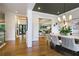 Elegant dining room with stylish lighting, modern decor, and an open view to the living area at 11 Brownson Ct, Acworth, GA 30101