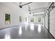 Spacious three-car garage with epoxy floor and large windows for natural light at 11 Brownson Ct, Acworth, GA 30101
