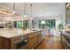 Open-concept kitchen with island, pendant lights, stainless appliances, and hardwood floors at 11 Brownson Ct, Acworth, GA 30101