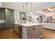 Spacious kitchen island with counter seating, stainless steel appliances, and stylish finishes in an open-concept design at 11 Brownson Ct, Acworth, GA 30101
