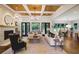 Bright and airy living room boasts a fireplace, wood ceiling, and an open floor plan at 11 Brownson Ct, Acworth, GA 30101