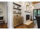 Stylish built-ins frame a cozy fireplace in this elegant living room with hardwood floors and accent lighting at 11 Brownson Ct, Acworth, GA 30101