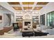 Inviting living room with coffered ceilings, a cozy fireplace, and built-in shelving, perfect for relaxation at 11 Brownson Ct, Acworth, GA 30101