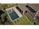Inviting backyard pool with lounge chairs and a covered porch, perfect for outdoor relaxation at 11 Brownson Ct, Acworth, GA 30101