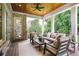 Inviting outdoor porch featuring comfortable seating, and a ceiling fan, perfect for relaxation at 11 Brownson Ct, Acworth, GA 30101