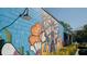 Exterior wall painted with colorful modern mural art at 1303 Lakota Pl # 20, Atlanta, GA 30315