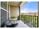 Cozy balcony with chairs and a table overlooking the complex at 2300 Peachford Rd # 2404, Atlanta, GA 30338