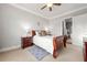 Comfortable bedroom featuring a plush bed, soft carpet, and en-suite bathroom, creating a relaxing retreat at 2300 Peachford Rd # 2404, Atlanta, GA 30338