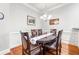 Elegant dining area featuring a large table, hardwood floors, and soft, neutral wall colors at 2300 Peachford Rd # 2404, Atlanta, GA 30338