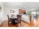 Formal dining room with wainscoting, hardwood floors, and a traditional chandelier at 2300 Peachford Rd # 2404, Atlanta, GA 30338