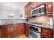 Modern kitchen showcasing granite countertops and stainless steel appliances at 2300 Peachford Rd # 2404, Atlanta, GA 30338
