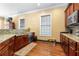 Charming kitchen with wooden cabinets, granite countertops, and modern appliances at 2300 Peachford Rd # 2404, Atlanta, GA 30338