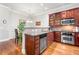 Modern kitchen with stainless steel appliances, granite countertops, and rich wood cabinetry at 2300 Peachford Rd # 2404, Atlanta, GA 30338