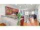 Open kitchen with granite countertops, stainless steel appliances, and hardwood floors at 2300 Peachford Rd # 2404, Atlanta, GA 30338