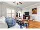 Inviting living room featuring large windows, hardwood floors, and tasteful decor, creating a cozy and stylish space at 2300 Peachford Rd # 2404, Atlanta, GA 30338