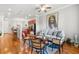 Open-concept living room with hardwood floors and comfortable seating, flowing into the adjacent kitchen at 2300 Peachford Rd # 2404, Atlanta, GA 30338