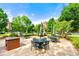 Inviting outdoor patio area with tables, chairs and manicured landscaping at 2300 Peachford Rd # 2404, Atlanta, GA 30338