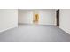 Open basement featuring gray concrete floor and an open doorway leading to another room at 245 London Ln, Hiram, GA 30141