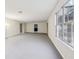 Spacious basement featuring concrete flooring and large windows for natural light at 245 London Ln, Hiram, GA 30141
