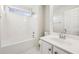 Functional bathroom with a shower-tub, vanity and a large mirror at 245 London Ln, Hiram, GA 30141