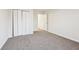 Bedroom with closet space, neutral carpeting, and light walls creating a calm space at 245 London Ln, Hiram, GA 30141