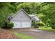 Charming home with two-car garage, mature trees, and well-maintained landscaping at 245 London Ln, Hiram, GA 30141