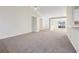Open concept living room with adjacent kitchen and entryway at 245 London Ln, Hiram, GA 30141