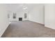 Spacious living room with fireplace and adjacent kitchen area at 245 London Ln, Hiram, GA 30141