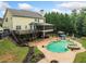 Stunning backyard featuring a private pool, spa, multi-level deck, and outdoor entertaining space at 360 Glade Knoll Trail Trl, Fayetteville, GA 30215