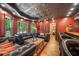Basement living area with wet bar, dark wood features and plush seating at 360 Glade Knoll Trail Trl, Fayetteville, GA 30215