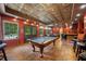 Spacious basement featuring a pool table, bar area, and outdoor access at 360 Glade Knoll Trail Trl, Fayetteville, GA 30215