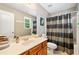 Bright bathroom with wood vanity, neutral walls, tub and shower combination at 360 Glade Knoll Trail Trl, Fayetteville, GA 30215