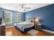 Cozy bedroom featuring hardwood floors, natural light, and neutral tones at 360 Glade Knoll Trail Trl, Fayetteville, GA 30215