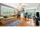 Spacious bonus room with hardwood floors, natural light, and ample space for entertaining at 360 Glade Knoll Trail Trl, Fayetteville, GA 30215