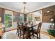 Formal dining room featuring hardwood floors, large windows, and stylish decor at 360 Glade Knoll Trail Trl, Fayetteville, GA 30215