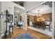 Open-concept dining room adjacent to the foyer with hardwood floors and modern chandelier at 360 Glade Knoll Trail Trl, Fayetteville, GA 30215