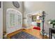 Inviting foyer with arched double doors, hardwood floors, and an open view into an office at 360 Glade Knoll Trail Trl, Fayetteville, GA 30215