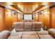 Luxurious home theater featuring tiered seating, sconce lighting, and speakers at 360 Glade Knoll Trail Trl, Fayetteville, GA 30215