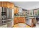 Well-lit kitchen featuring stainless steel appliances and a breakfast bar at 360 Glade Knoll Trail Trl, Fayetteville, GA 30215