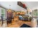 Open kitchen featuring hardwood floors, breakfast bar, and modern lighting at 360 Glade Knoll Trail Trl, Fayetteville, GA 30215