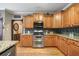 Classic kitchen featuring granite counters, stainless steel appliances, and ample cabinetry at 360 Glade Knoll Trail Trl, Fayetteville, GA 30215