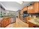 Spacious kitchen featuring stainless steel appliances and granite countertops at 360 Glade Knoll Trail Trl, Fayetteville, GA 30215