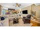 Bright living room featuring a comfortable sofa, chair and a ceiling fan at 360 Glade Knoll Trail Trl, Fayetteville, GA 30215