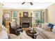 Bright living room showcasing a stone fireplace, staircase and comfortable furniture at 360 Glade Knoll Trail Trl, Fayetteville, GA 30215