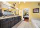 Elegant main bathroom with dual sinks, granite countertops, walk-in shower and soaking tub at 360 Glade Knoll Trail Trl, Fayetteville, GA 30215