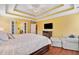 Spacious main bedroom with hardwood floors, tray ceiling, and ample natural light at 360 Glade Knoll Trail Trl, Fayetteville, GA 30215