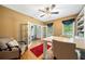 Bright office with french doors, hardwood floors, built-in shelves, and a ceiling fan at 360 Glade Knoll Trail Trl, Fayetteville, GA 30215