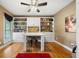 Bright office featuring built-in bookshelves, hardwood floors, and a neutral color scheme at 360 Glade Knoll Trail Trl, Fayetteville, GA 30215